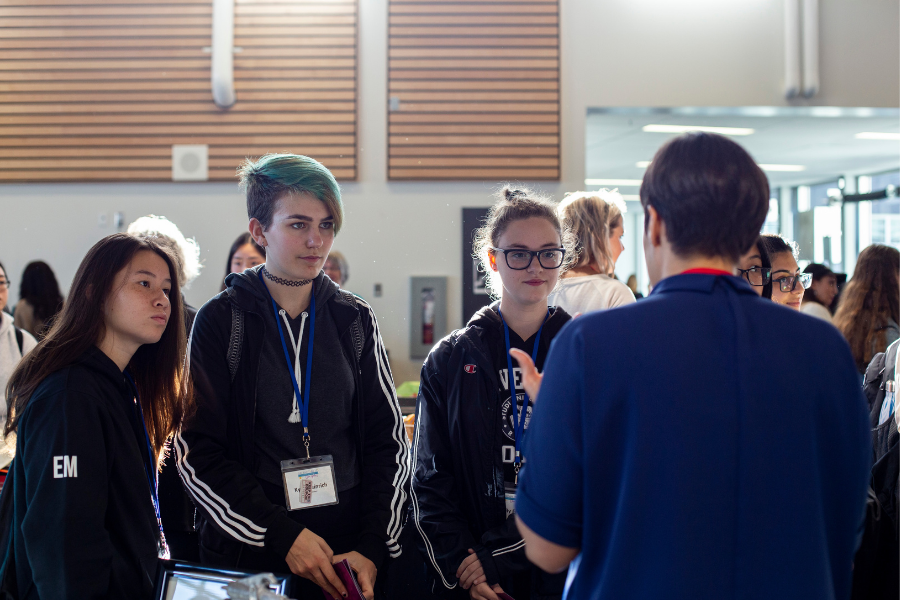Young women chatting with dentist about future careers options